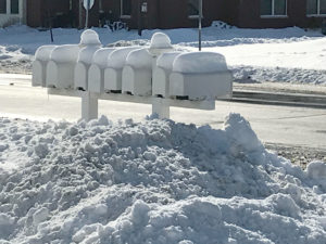 Mailbox row covered in snow