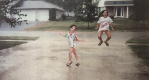 Kristin's daughters singing and splashing in the rain