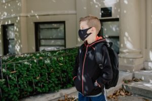 School boy wearing a mask