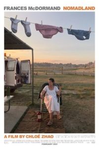 Official Nomandland Poster - Frances McDormand sitting by her van with laundry hanging above her