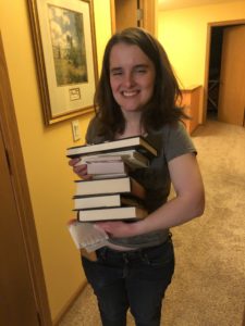Kristin's daughter Jessica with her stack of books