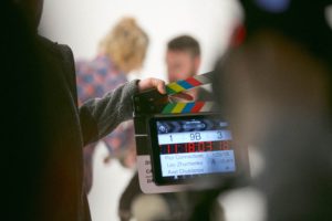 Movie clapboard with two actors 