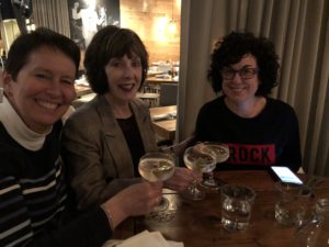 Kristin sitting with Samantha Hoffman and Ann Garvin