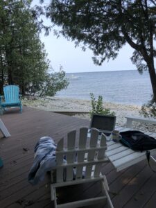 Adirondack chairs on the shore of Lake Michigan