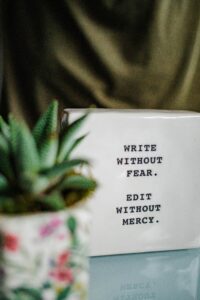 Sign that says, "Write without fear. Edit without mercy."