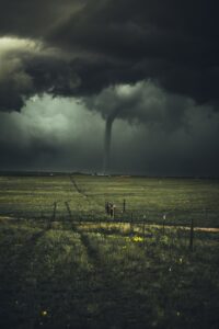 A distant tornado in a field