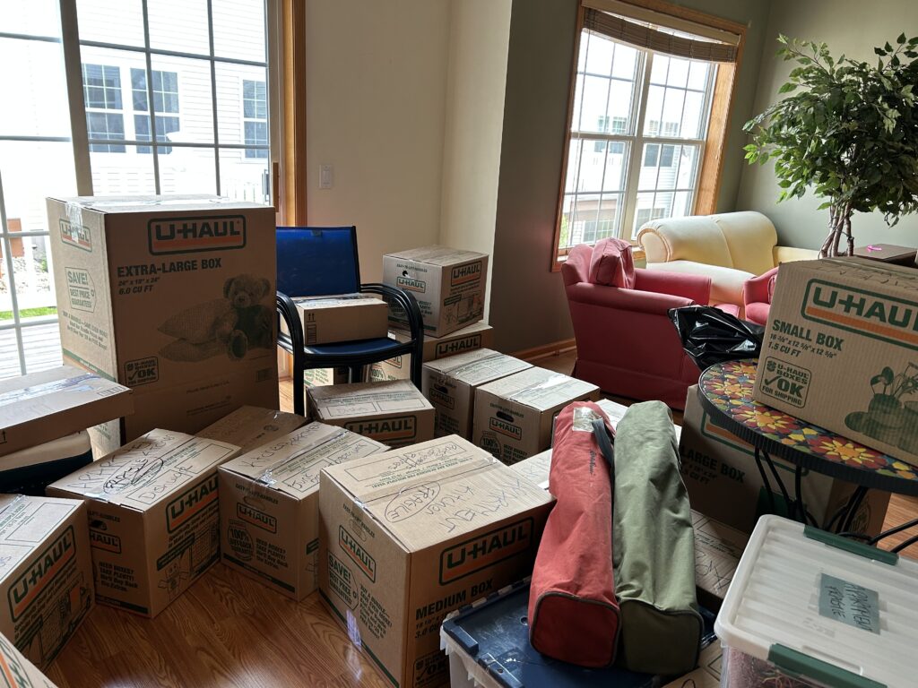 Kristin's living room filled with boxes
