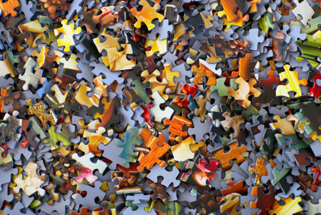 A scattering of jigsaw puzzle pieces
