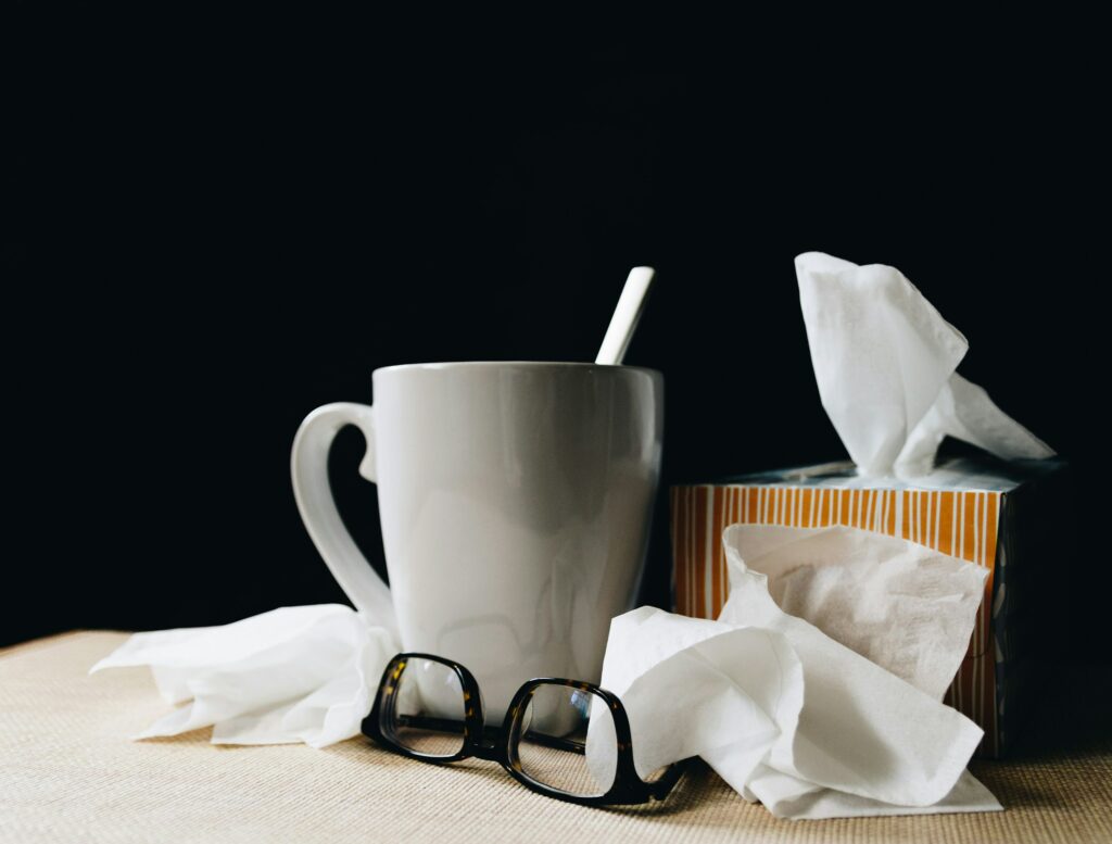 Tea cup, glasses, and tissues