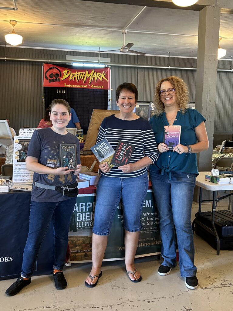 Abigail Morrison, Kristin Oakley, and Meadoe Hora holding their books